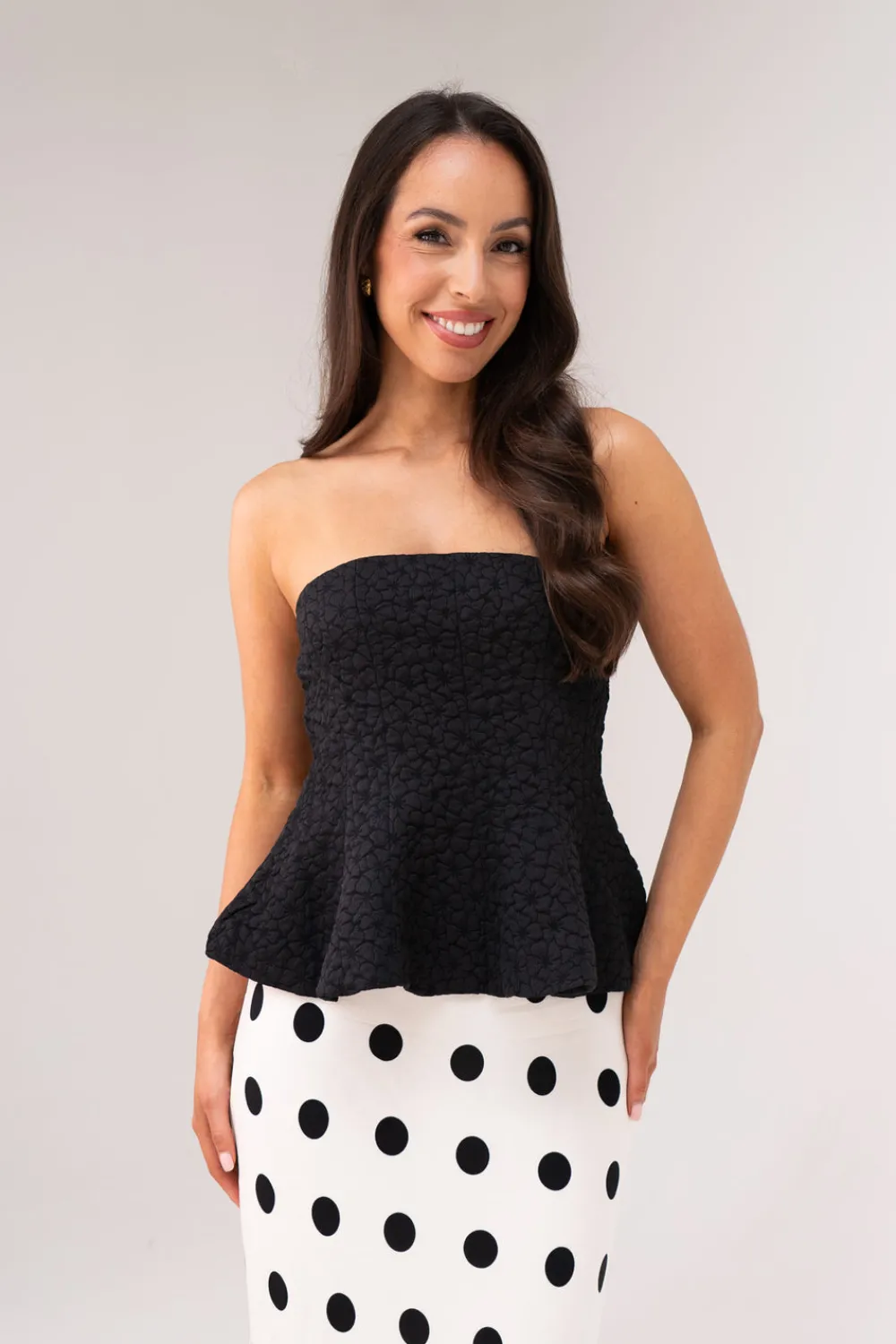 The Walk in Wardrobe Tops>Iris Textured Peplum Top In Black